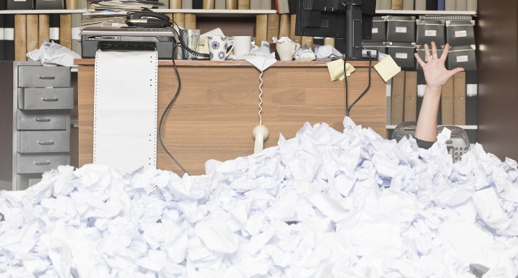 Office with wads of paper overflowing